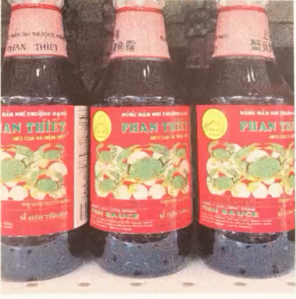 Photograph of Phan Thiet fish sauce bottles, from an ongoing series on Vietnamese American pantry staples.